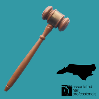 Brown gavel over teal background with shape of North Carolina
