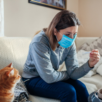 An image of AHP member taking temperature