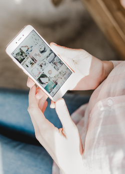 An image of woman holding smartphone