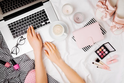 cute laptop stuff on bed