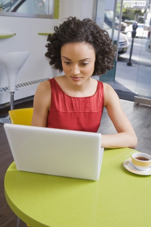 curly hair girl at computer