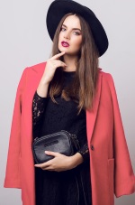 girl in black hat and peach blazer