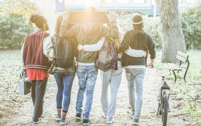 group walking with skateboard