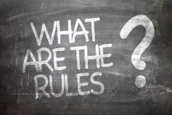 An image of chalkboard with What are the rules? written on it.