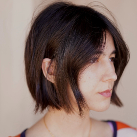 Young woman with brunette hair cut into a short blunt bob