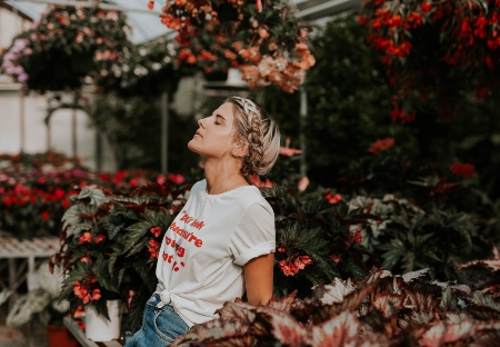 A stock image of woman with eyes closed looking up