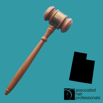 Brown gavel on teal background with shape of Utah.