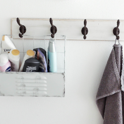 A stock image of hooks with towels and caddy