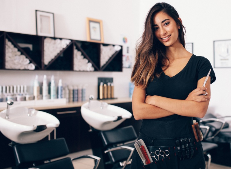 A stock image of hairstylist holding scissors