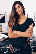 A stock image of hairstylist holding scissors