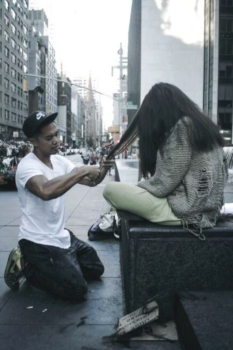 An image mark bustos giving hair cut on street