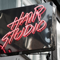 An image of a hair studio neon sign