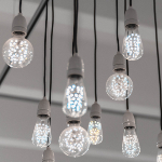 A stock image of hanging light bulbs