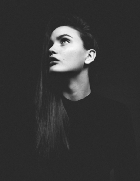 A black and white stock image of woman looking up