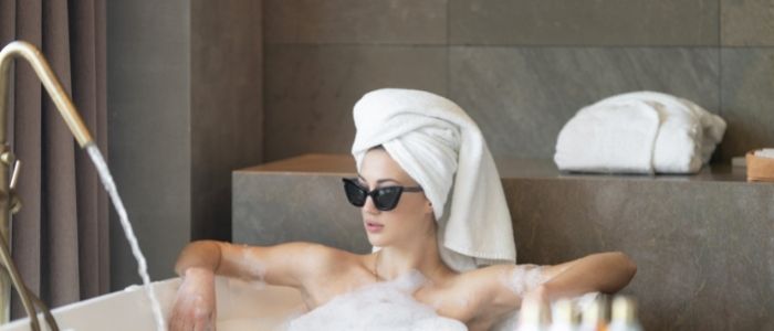 woman with sunglasses in bath