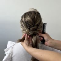 Adding two twists to over direct each section and create a bun, secured with pins.