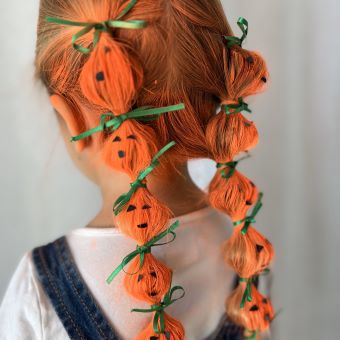 Woman with a pumpkin hairstyle.