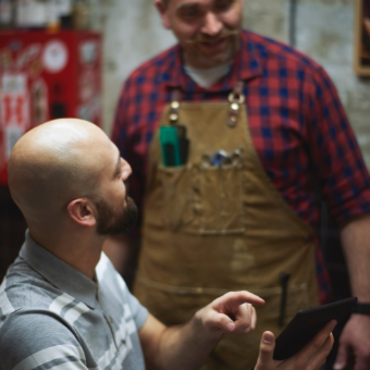 Barber consults with client