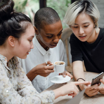 group of women looking at social media