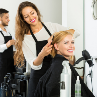 smiling client in the hairdresser chair