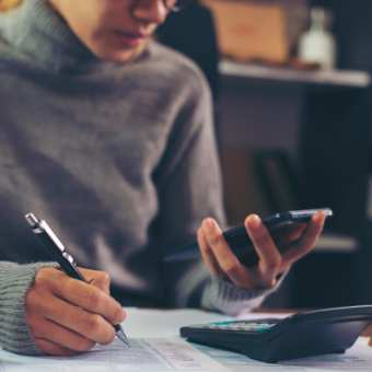 woman calculating taxes