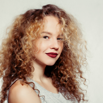 woman with golden curly hair