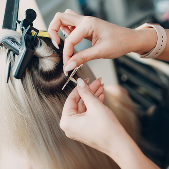 AHP member applying hair extensions