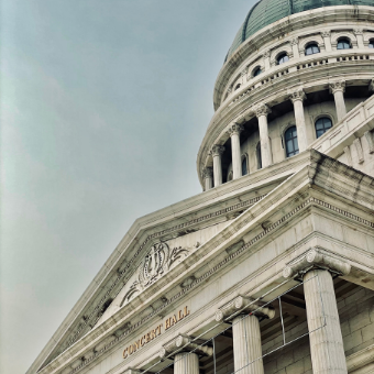 Capitol building with grey clouds