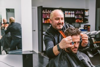 hairdresser consults with client