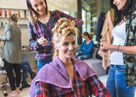 Hairstylist performing an updo