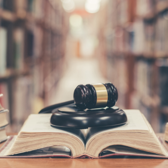 Gavel resting on an open book