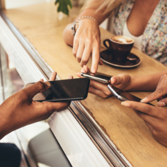 women sharing phone information