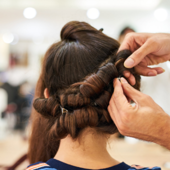 client gets hair pinned and curled