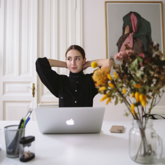 Woman sitting in front of her laptop