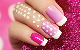 Nail design pink, purple and polka-dot nails.
