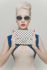 girl holding a polka dot purse