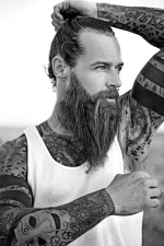 black and white tattooed bearded man