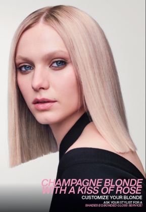 A model shows off her champagne blond with a kiss of rose hair coloring, the Redken hair color of the year.